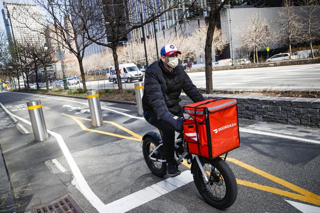 A delivery worker rides his bicycle along a path on the West Side Highway March 16th.